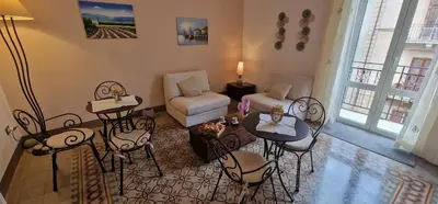 a living room with chairs and a table and a couch at Eureka in Palermo