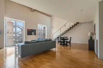 a living room with a couch and a table at Cala Loft by Wonderful Italy in Palermo