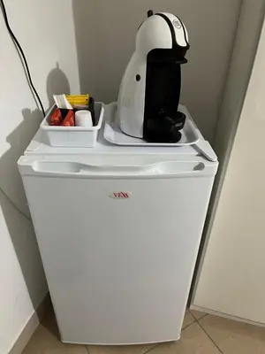 a mixer sitting on top of a white refrigerator at Lercarappart in Lercara Friddi