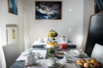 a dining room table with food on it at Trikeles in Palermo