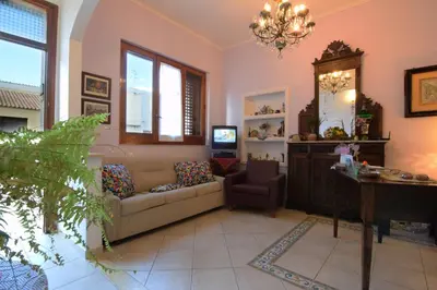 a living room with a couch and a table at B&B Alighieri 21 in San Vito lo Capo