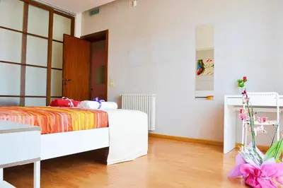 a bedroom with a bed and a dresser in it at Appartamento da Andrea in Alcamo