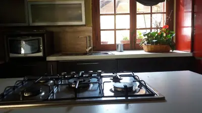 a stove top in a kitchen with a window at Villa Giannì in Palermo