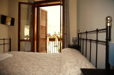 an archway in a room with an open door at BnB DonnaLaura in Carini