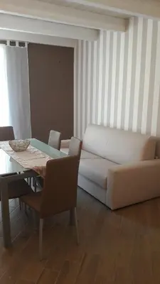a living room with a couch and a table at Casa Vacanze TAMARA in Balestrate
