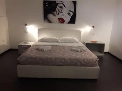 a bedroom with a bed with two towels on it at A un passo dal Massimo in Palermo