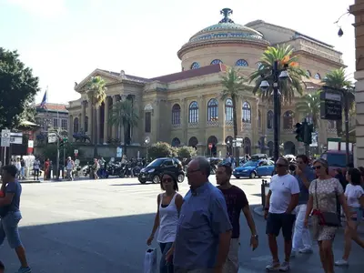 a group of people standing in front of a building at A un passo dal Massimo in Palermo