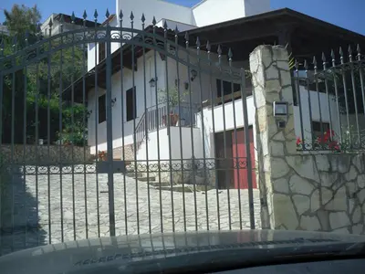 a wrought iron fence in front of a building at Vicino al mare e lontano dai rumori in Alcamo Marina