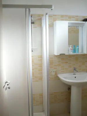 a bathroom with a sink and a shower at Vicino al mare e lontano dai rumori in Alcamo Marina