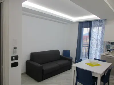 a living room with a couch and a table at Le Dimore di Enea in Castellammare del Golfo