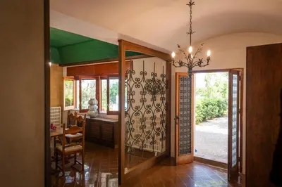 a hallway with a door open to a dining room at Casa del carrubo in Carini