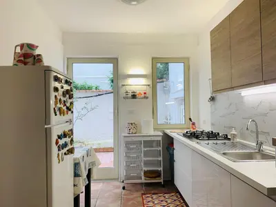a kitchen with a refrigerator and a sink at House in Mondello in Mondello