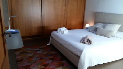 a hotel room with two beds with towels on them at Appartamento Alloro 2 in Palermo