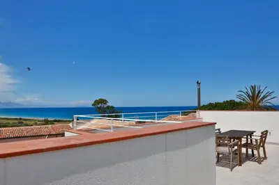 a view of the ocean from the balcony of a house at casa verdemare in Cefalù