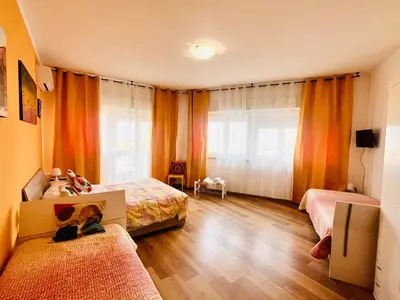 a bedroom with two beds and a window at LeAlbe di Sicilia in Palermo