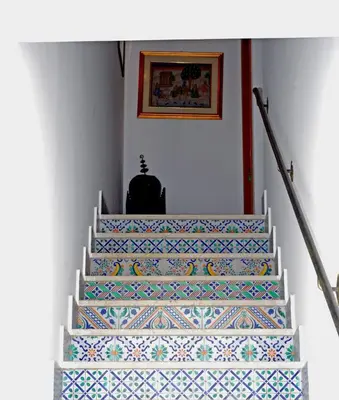 a stairway with colorful tiles on the stairs at Senia in San Vito lo Capo