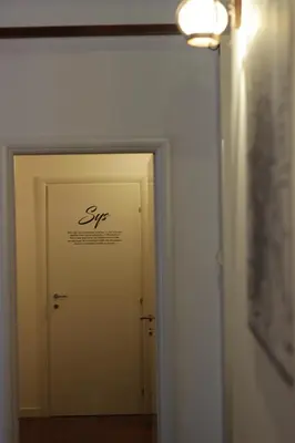 a door leading to a room with a sign on it at B&B Gallidoro in Palermo