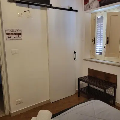 a room with a sliding door and a bench at 
