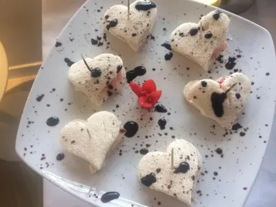 a plate with hearts shaped desserts on it at B&B Mondello Design in Mondello