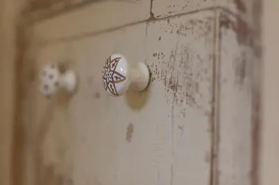 a wooden door with white knobs on a wall at Piazza Marina in Palermo