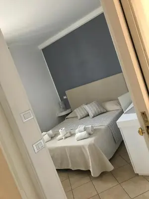 a bedroom with a bed with towels on it at B&B Timpe Bianche in Castelluzzo