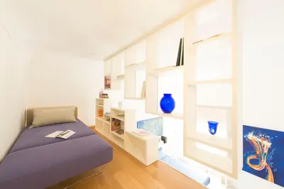 a small room with a bed and a window at Gattopardo Apartments - LAGO Design by Wonderful Italy in Palermo