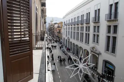 a view of a city street with a christmas tree at Balate Maqueda B&B in Palermo