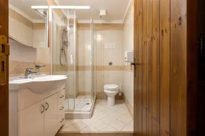 a bathroom with a toilet and a shower and a sink at Hotel Castello di Giuliano in Montelepre