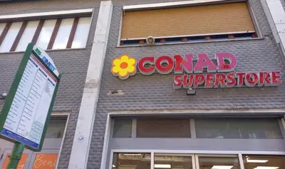 a sign on the side of a building with a central superstore at Casa del Cioccolato in Palermo