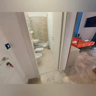 a bathroom with two sinks and two toilets in it at B&B D'Amico87 in Bagheria