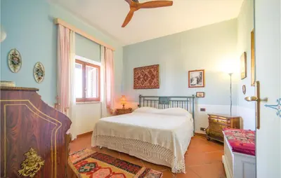a bedroom with a bed and a window at Beautiful Home In Partinico Pa in Balestrate