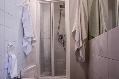 a shower with a glass door in a bathroom at Ciuri Ciuri Mondello in Mondello