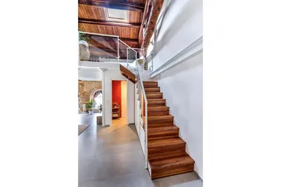 a staircase in a house with wooden ceilings at La Suite del Principe con parcheggio incluso in Palermo