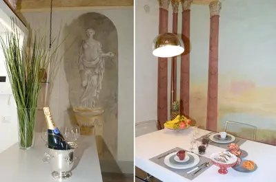 a table with a plate of food and a statue at La Suite del Principe con parcheggio incluso in Palermo
