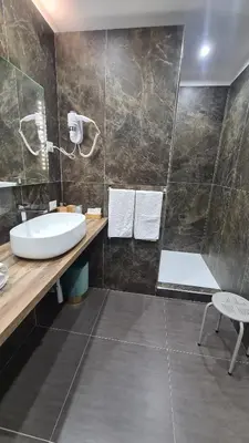 a bathroom with a sink and a bath tub at Ruggero Settimo Gallery in Palermo