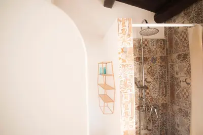 a shower in a bathroom with a shower curtain at Chibedda Dimora Cesca in Castellammare del Golfo