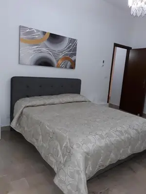 a bedroom with a bed and a painting on the wall at Elimo Affittacamere - Casa Vacanze di Scardino Leonardo in Poggioreale