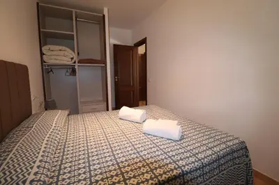 a bathroom with a toilet and a washing machine at casa Vincenzo in Castelluzzo