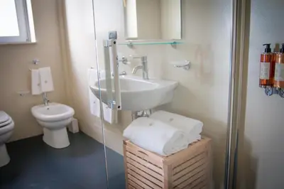 a bathroom with a sink and a toilet at Palazzo Planeta in Palermo