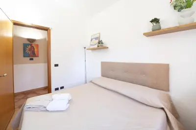 a bedroom with a bed with a white bedspread at Villa Eden con piscina a Scopello in Castellammare del Golfo
