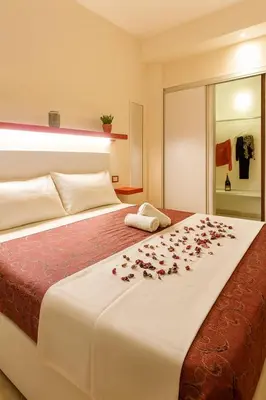 a bedroom with a bed with roses on it at BB45 in Palermo