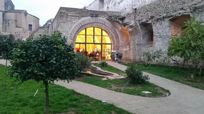 an old stone building with a large window at BB45 in Palermo