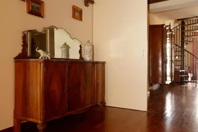 a wooden dresser with a mirror on top of it at Casa Matrangela in Palermo