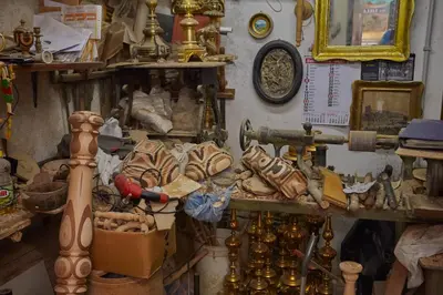 a room filled with lots of items on a wall at Casa Matrangela in Palermo