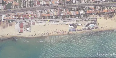 an aerial view of a beach with a crowd of people at Tonnara Apartments in Alcamo Marina