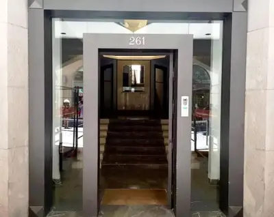 a revolving door to a building with a staircase at Overseas - Penthouse with terrace - Attico - Palazzo San Matteo in Palermo