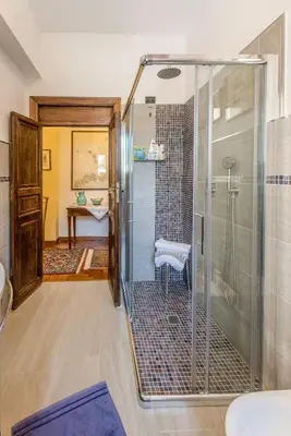 a bathroom with a shower with a glass shower stall at Green Garden 2017 in Mondello
