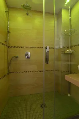 a shower with a glass door in a bathroom at B&B Le Porte Del Centro in Palermo