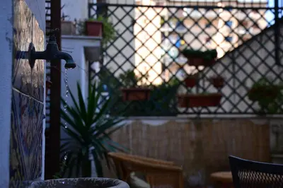 a room with a fence and a window with plants at il lapino in Palermo