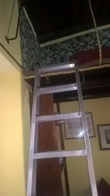 a ladder in a room with a bunk bed at Millimetro in Palermo
